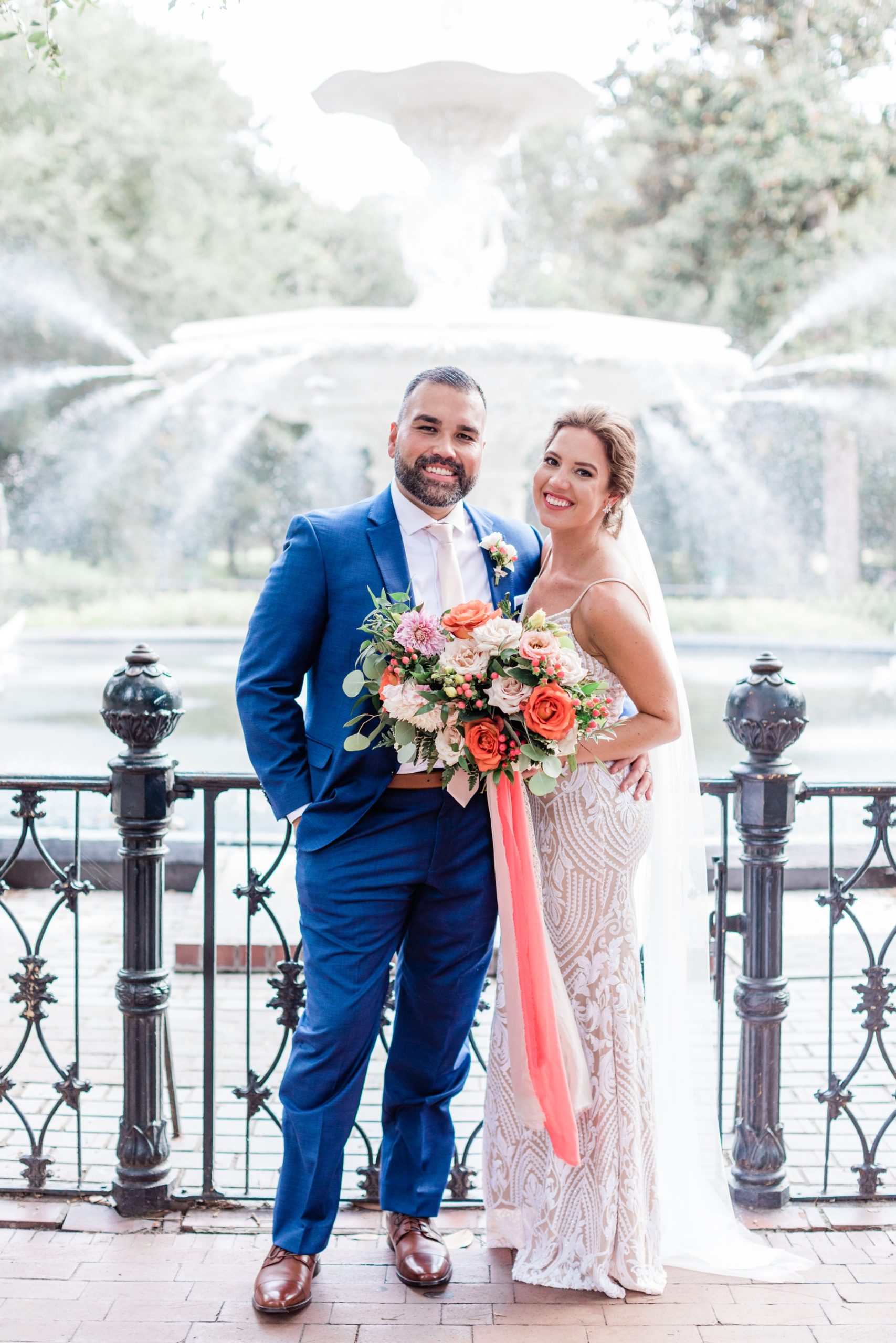 Bride and groom elopement portraits in front of Forsyth Fountain