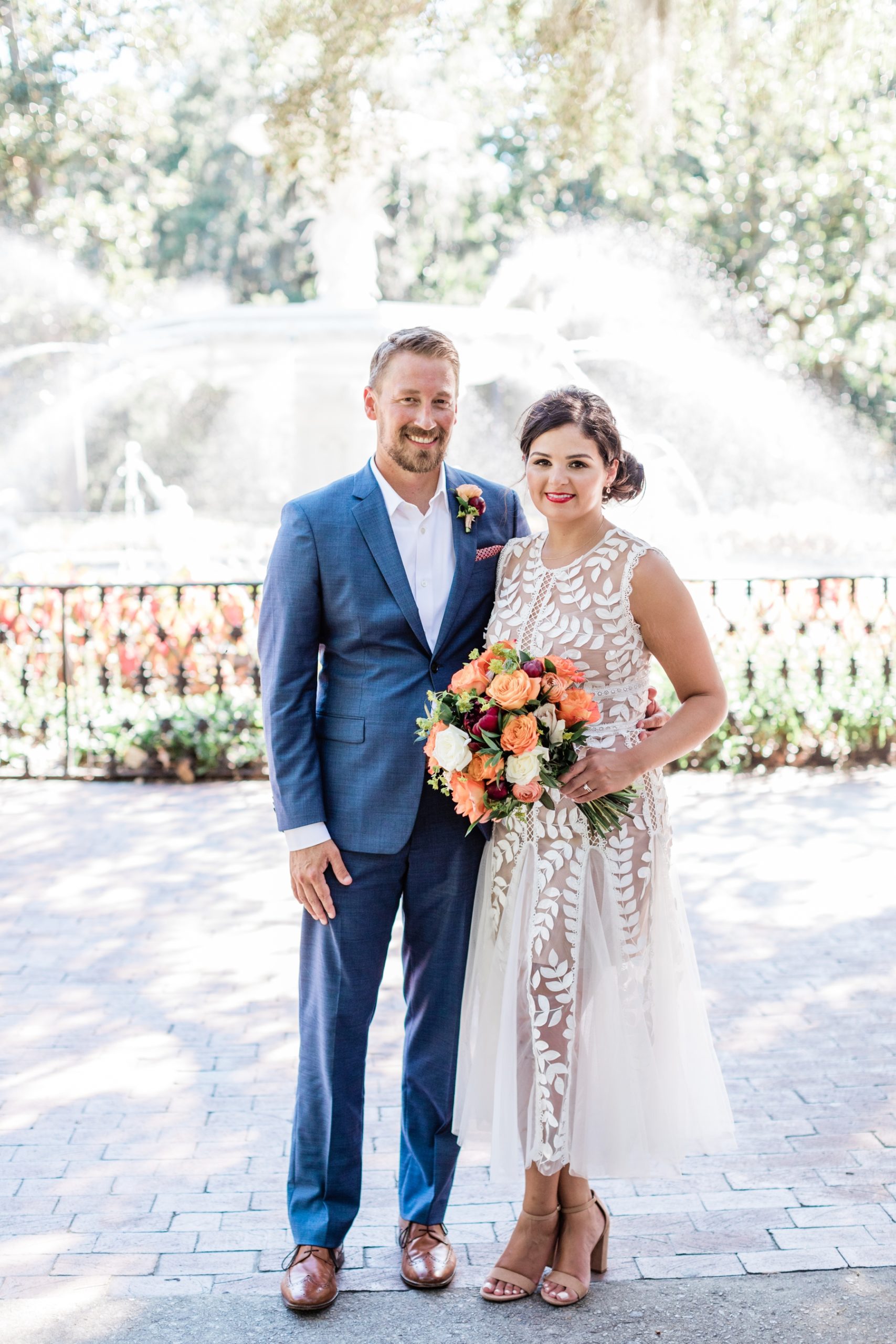 Bride and groom elopement portraits in front of Forsyth Fountain