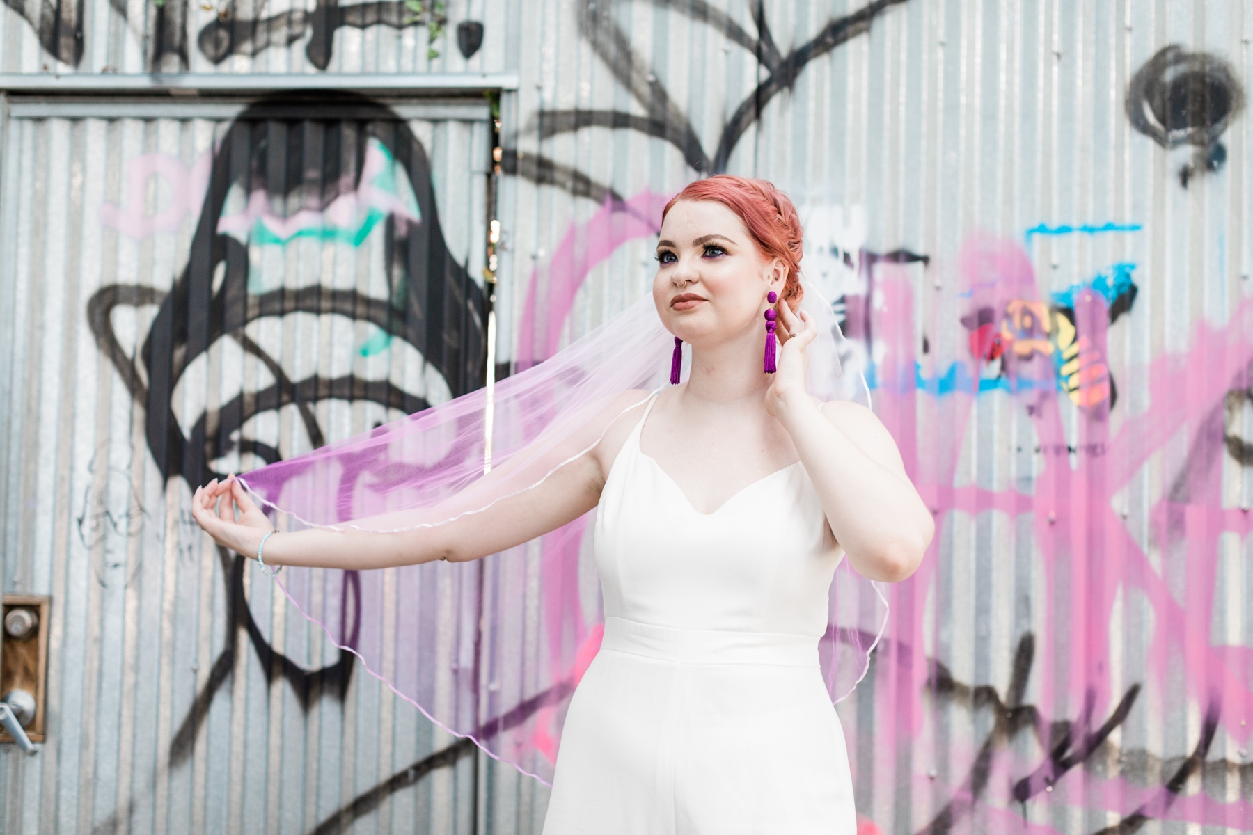 Bride in a jumpsuit and hand-dyed pink veil - Savannah Elopement