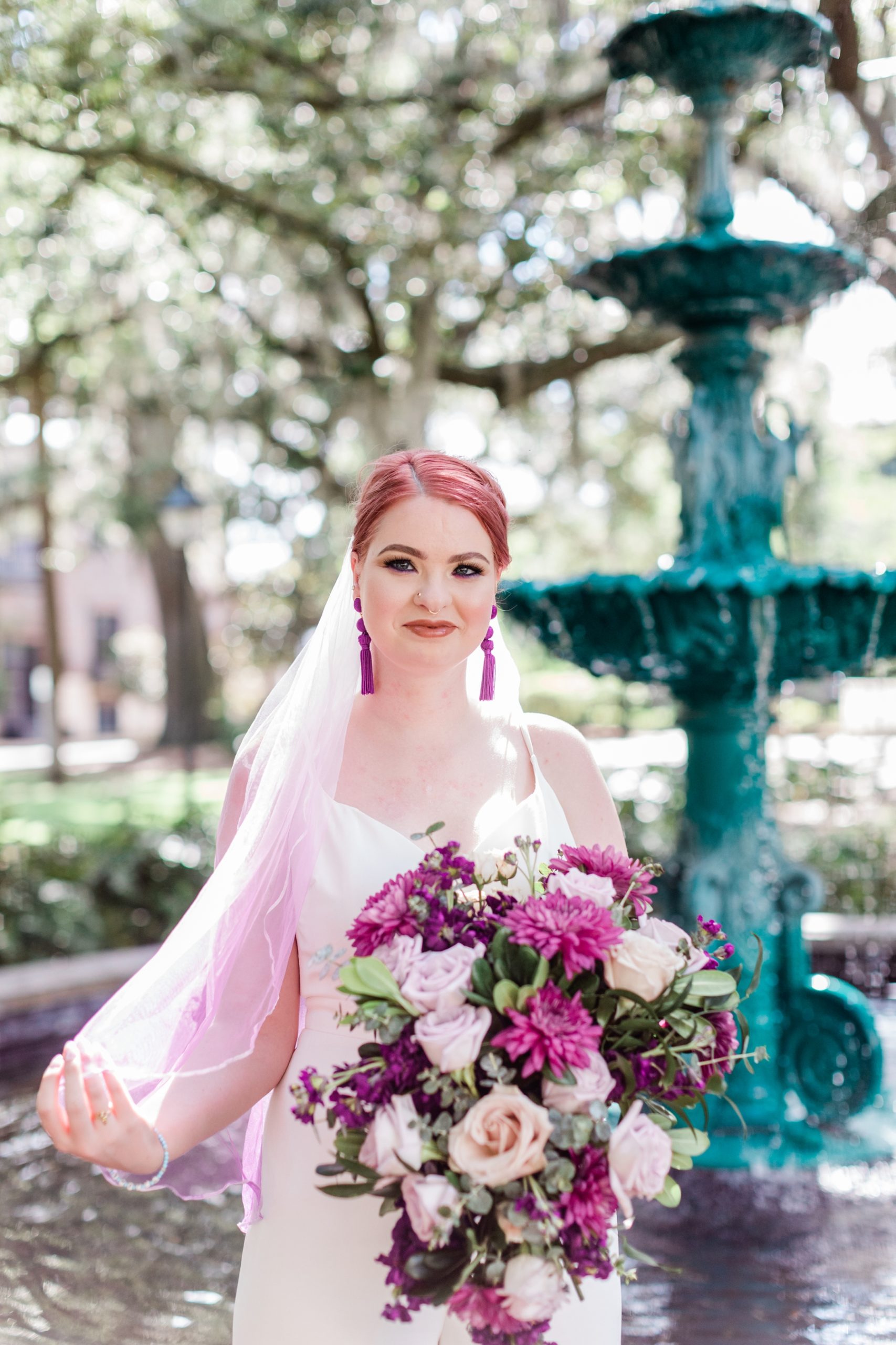 Bride in a jumpsuit and hand-dyed pink veil - Savannah Elopement