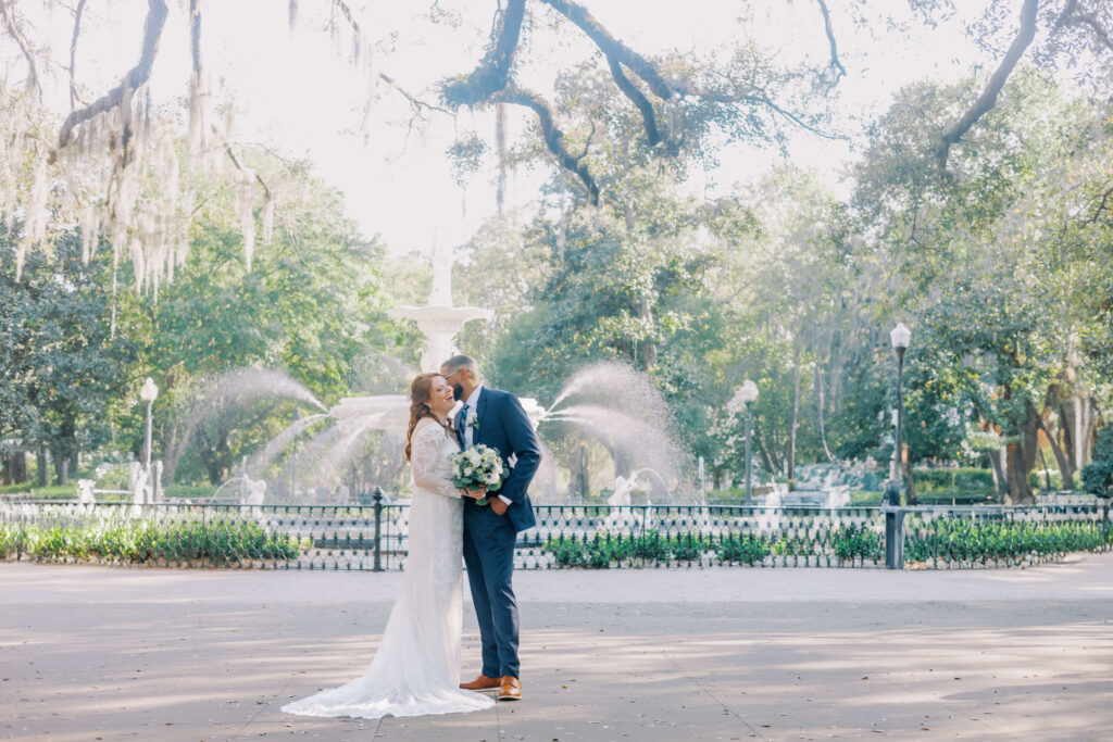 Couples smiles in Forsyth Park during their Savannah elopement