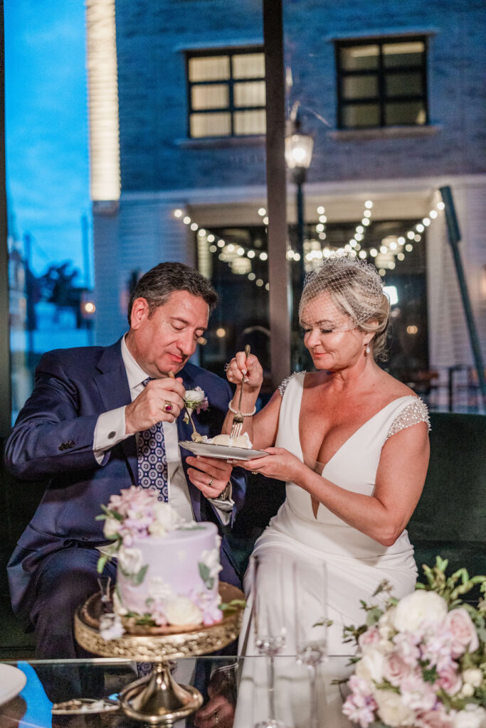 Couple cuts their cake during Savannah Elopement at Perry Lane Hotel